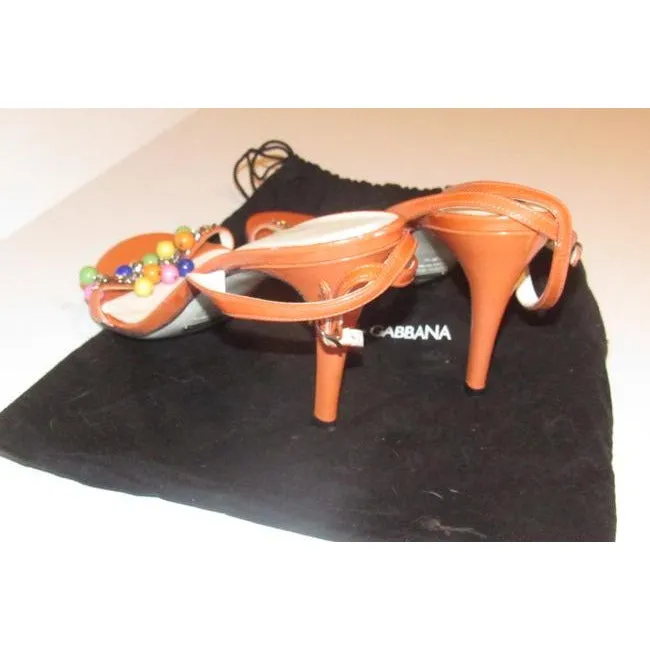 Dolce & Gabbana, new/unworn, dressier, strappy sandals or heels made of tangerine orange leather with colorful beads