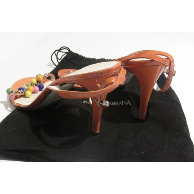 Dolce & Gabbana, new/unworn, dressier, strappy sandals or heels made of tangerine orange leather with colorful beads